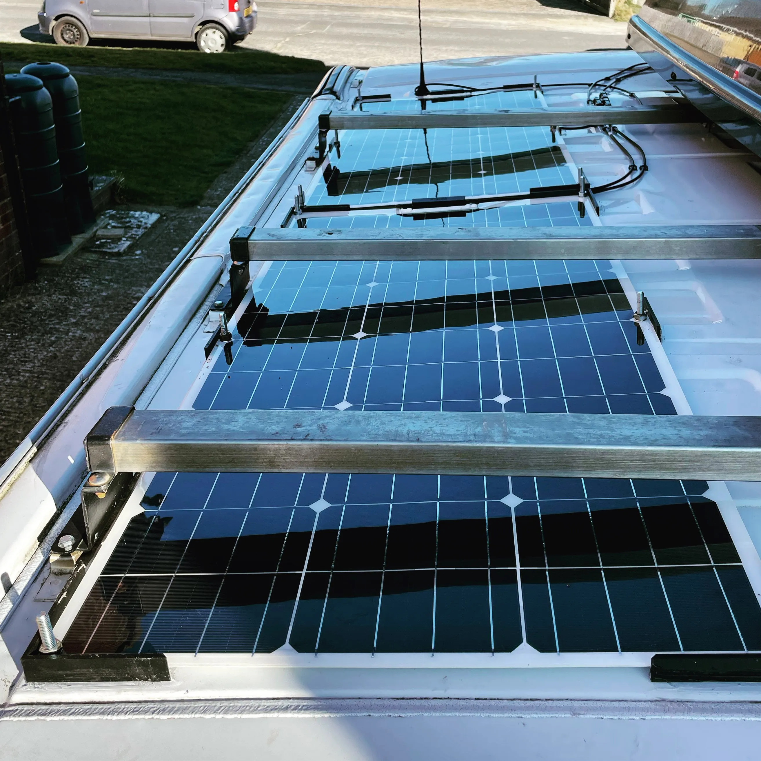 The original 2 100w flexible solar panels, mounted under the roof bars